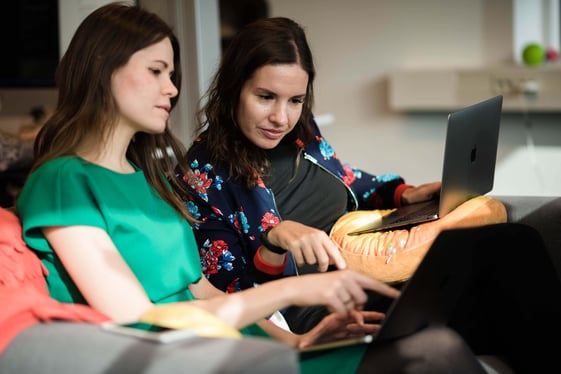 two women looking at a computer