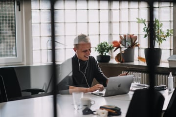 Man sitting by the desk.