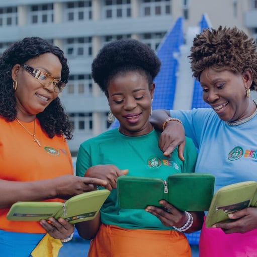 Three women looking at ipads.